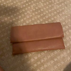 Brown leather fold over clutch